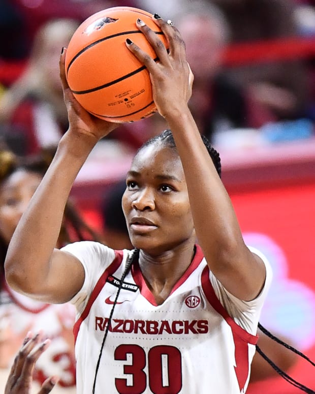 Razorbacks' Maryam Dauda puts up a shot down low against Mississippi State